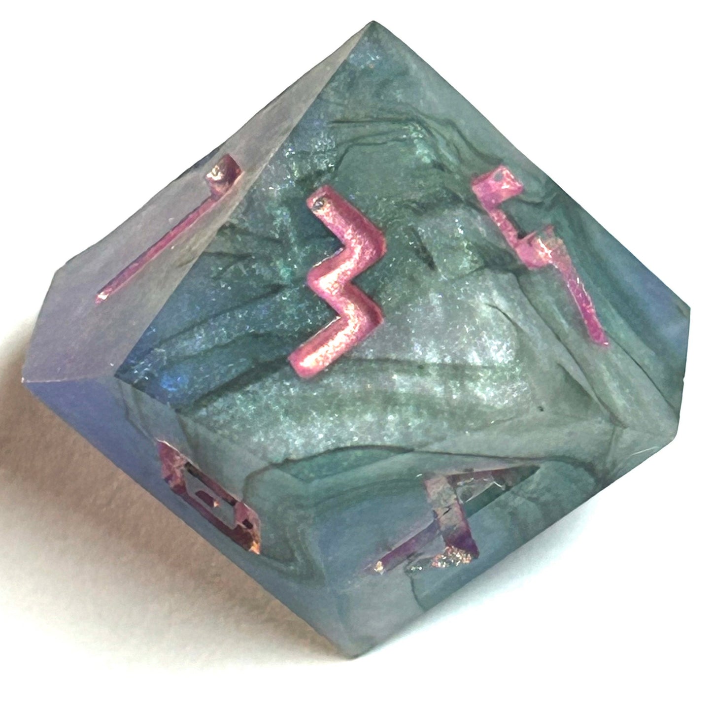 D10 die from the Embermist handmade resin dice set, featuring stormy blue resin tones and glowing rose engraved numerals