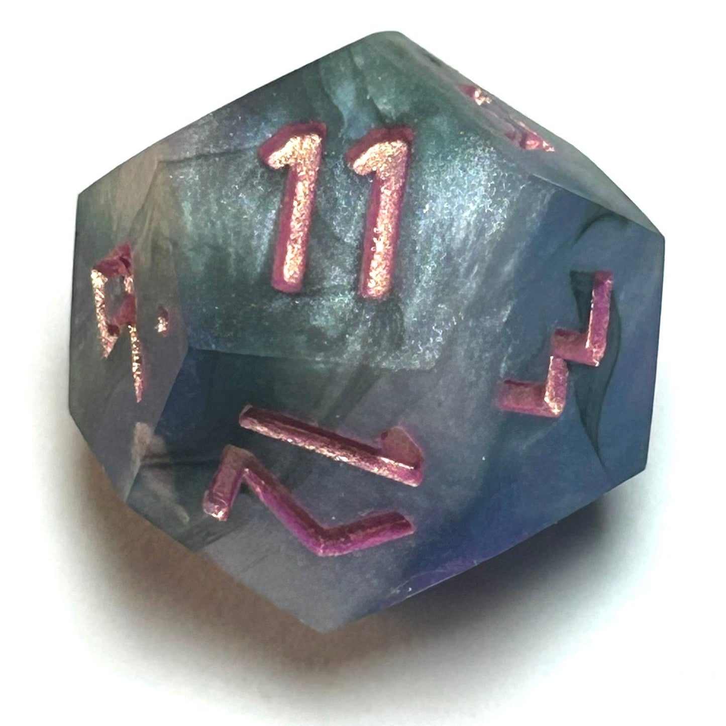 D12 die from the Embermist resin dice set with blue-gray swirling resin and luminous rose numbering