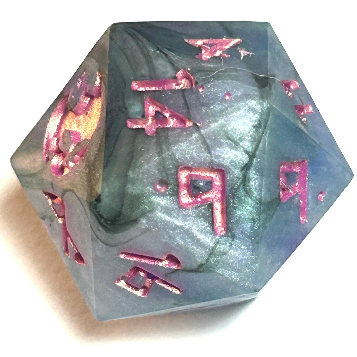 D20 die from the Embermist handmade resin dice set showing cloudy gray-blue resin with rose numbering and a mystical shimmer