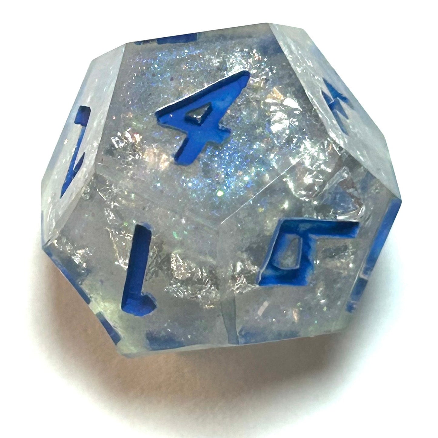 Clear resin dice d12 with silver shimmer and deep blue numbering, resembling fractured ice — Infernal Crafts Glacial Veil handmade resin dice