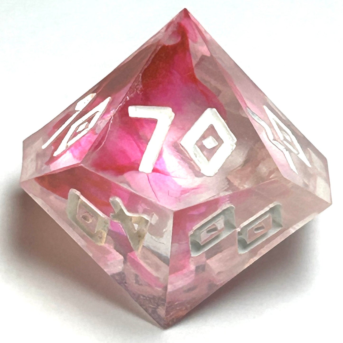 Percentile die from the Heartbreaker handmade resin dice set with deep red marbling and sharp white engraved numerals