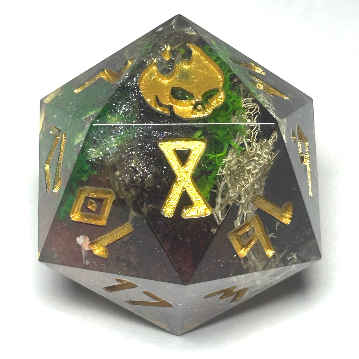 Oversized 35mm resin D20 die with a moss-inspired design and golden numbers, handmade for tabletop RPGs.