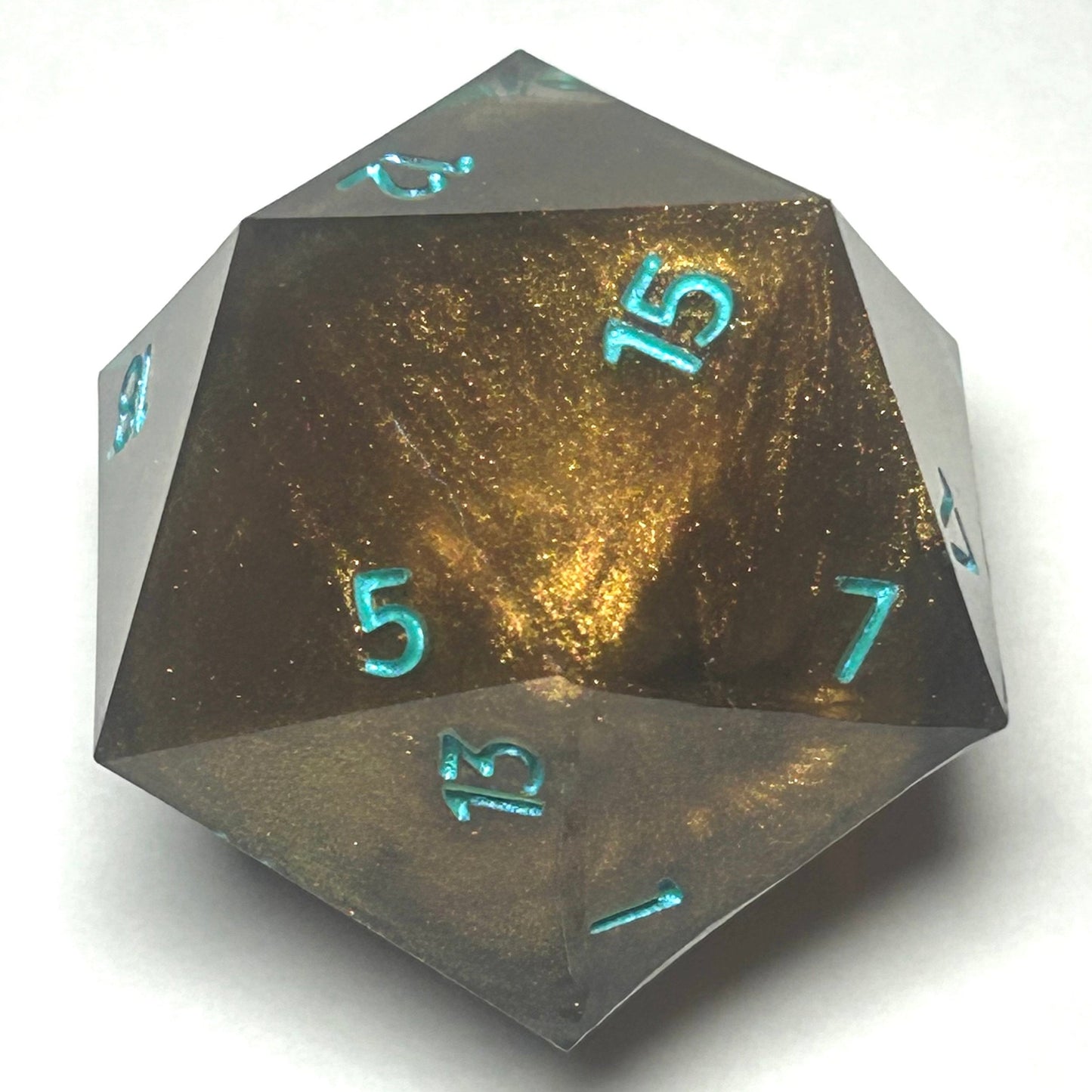 Large 40mm resin D20 featuring a glowing copper coil-like core inside clear resin with shimmering teal numbering.