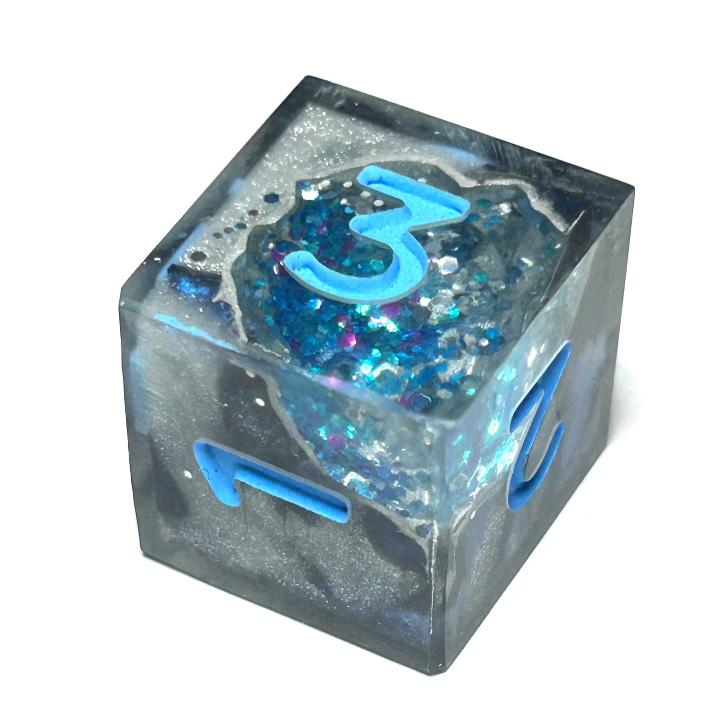 Clear geode style dice with blue number '3' on a white background