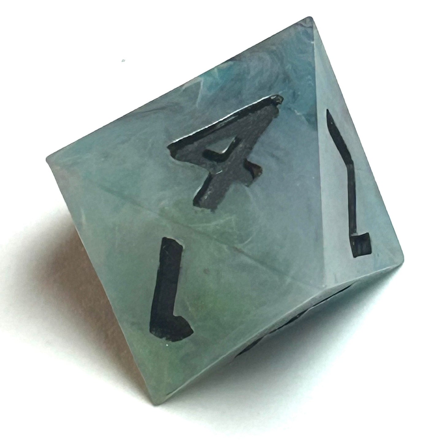 D8 die from the Mistbourne resin dice set, crafted from hand-poured teal and gray resin with dark black numbering