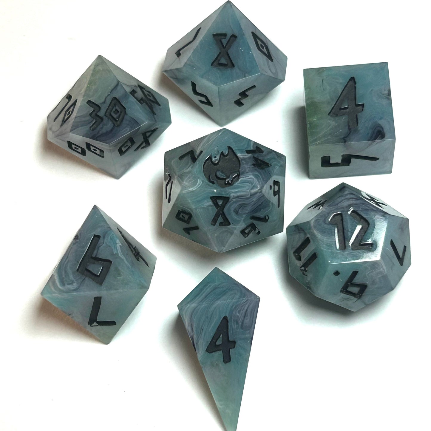 istbourne handmade resin dice set featuring swirling teal and gray resin with bold black numbering — full 7-piece set by Infernal Crafts