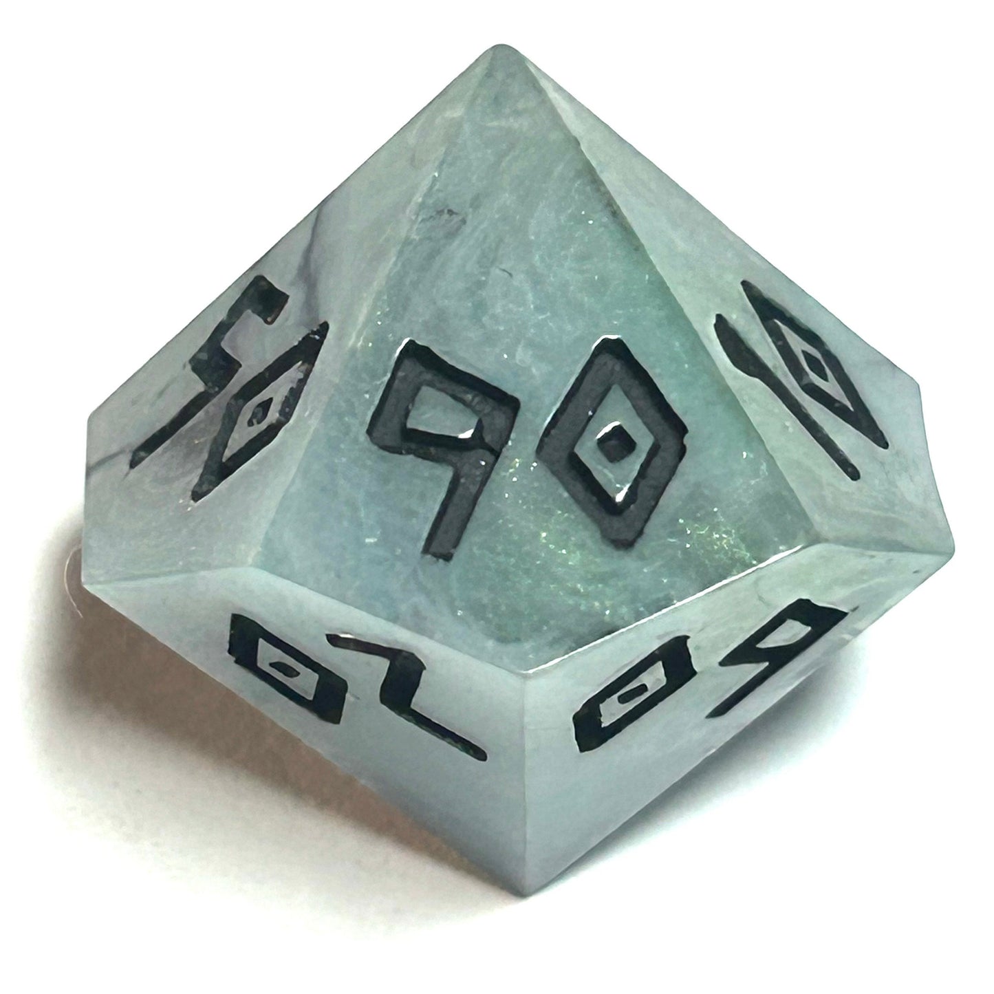 Percentile die from the Mistbourne handmade resin dice set featuring cool green-gray resin and deep black engraved numerals