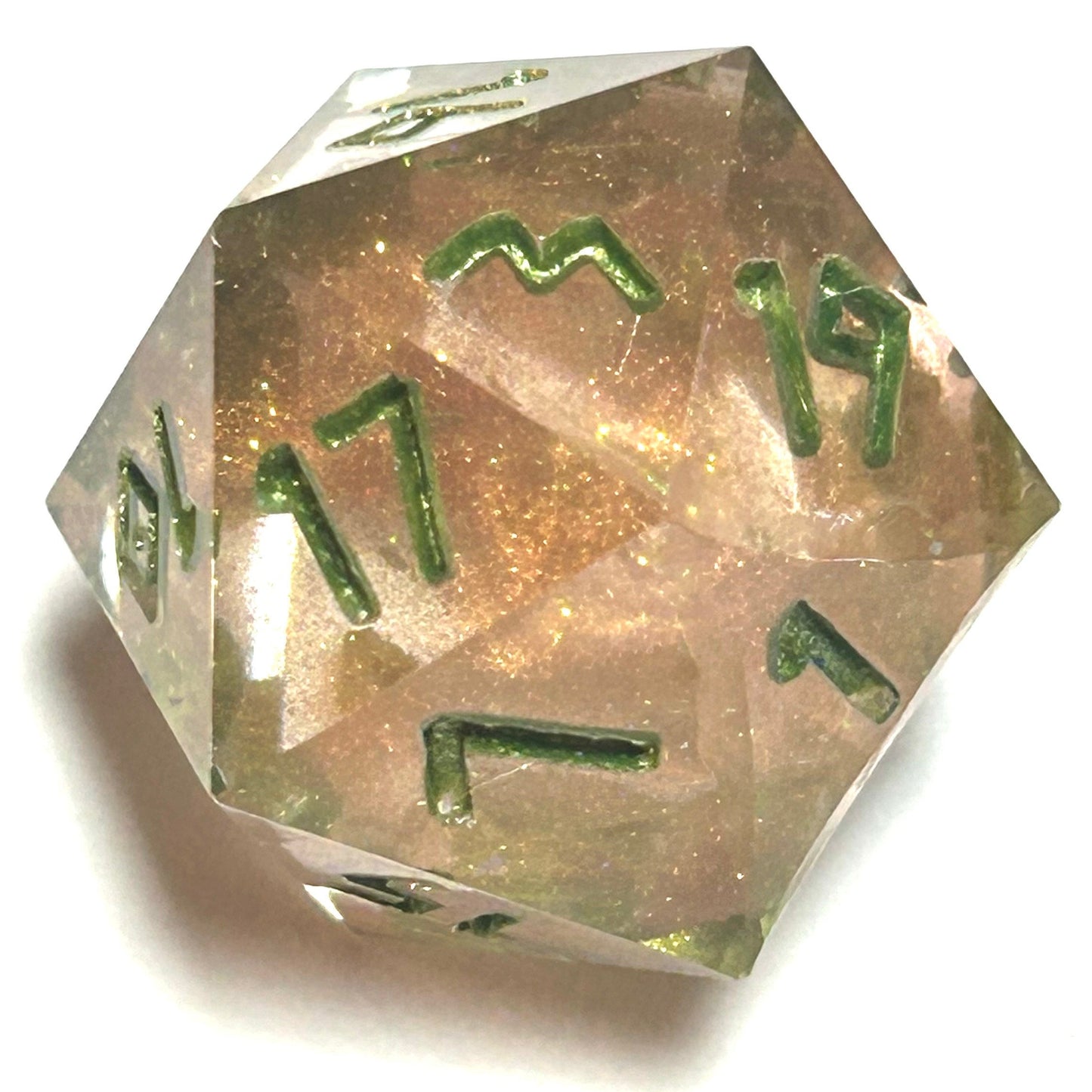 D20 die from the Verdigrace handmade resin dice set, with a warm blush resin core and luminous green numbering