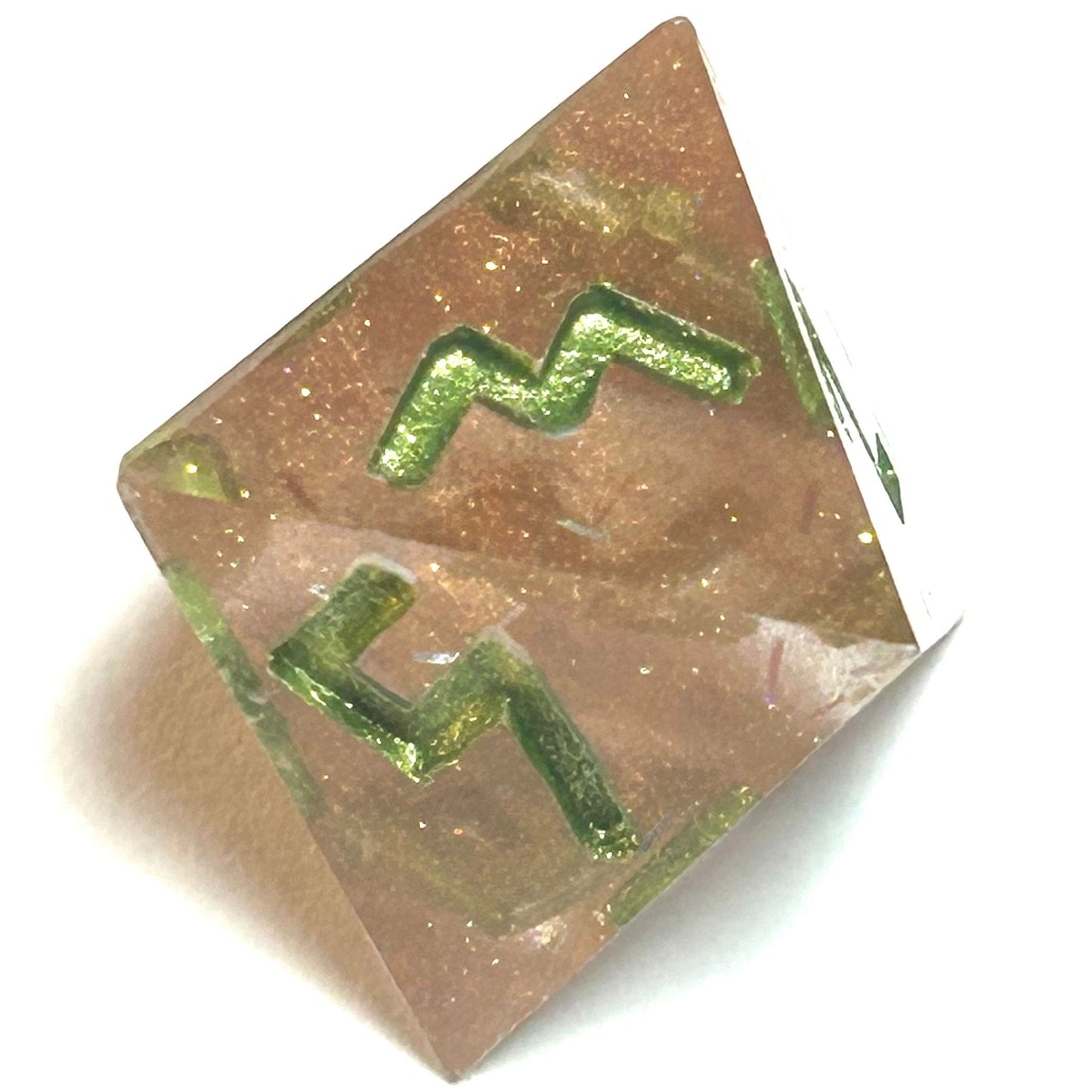 D8 die from the Verdigrace resin dice set featuring translucent golden blush resin and green engraved numerals