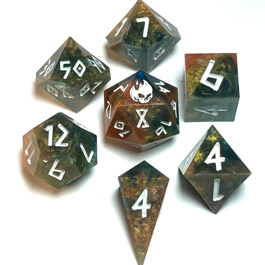 Handmade resin dice set with swirling green, gold, and bronze tones and white numbering — Infernal Crafts Eldritch Mire dice set