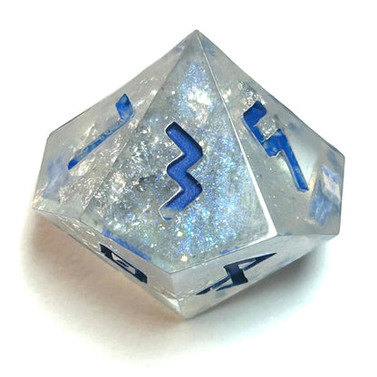 Clear resin dice d12 with silver shimmer and deep blue numbering, resembling fractured ice — Infernal Crafts Glacial Veil handmade resin dice