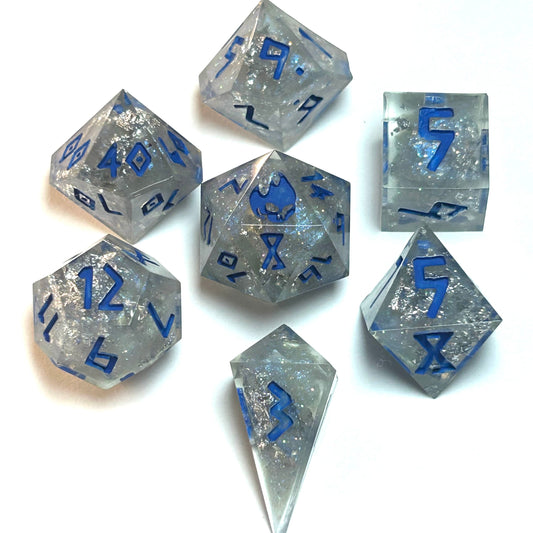 Clear resin dice set with silver shimmer and deep blue numbering, resembling fractured ice — Infernal Crafts Glacial Veil handmade resin dice set