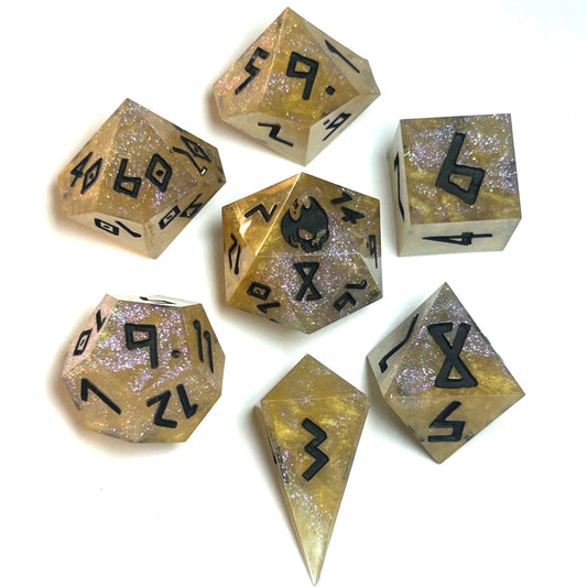 Translucent gold resin dice set with black numbering and fine glitter shimmer — Infernal Crafts Golden Mirage handmade resin dice set