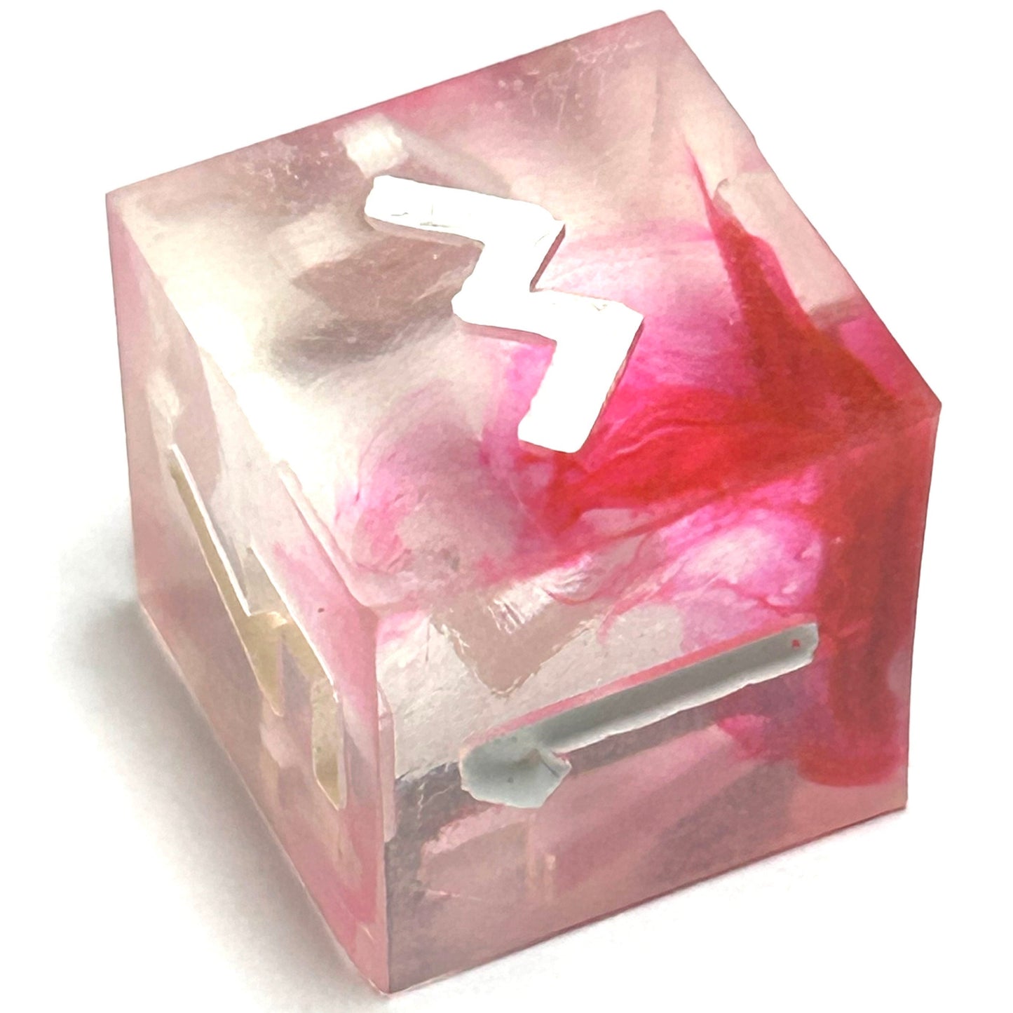 D6 die from the Heartbreaker resin dice set featuring translucent resin with deep red marbling and white engraved numbering