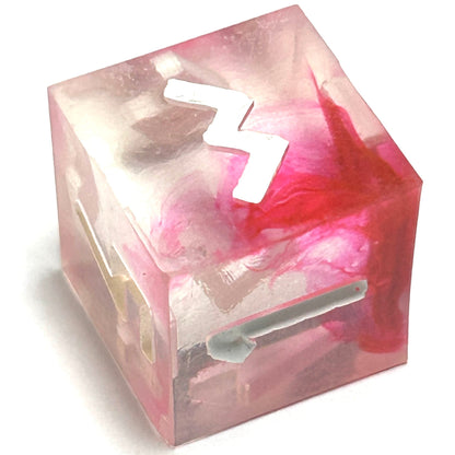 D6 die from the Heartbreaker resin dice set featuring translucent resin with deep red marbling and white engraved numbering