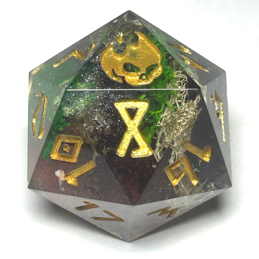 Oversized 35mm resin D20 die with a moss-inspired design and golden numbers, handmade for tabletop RPGs.