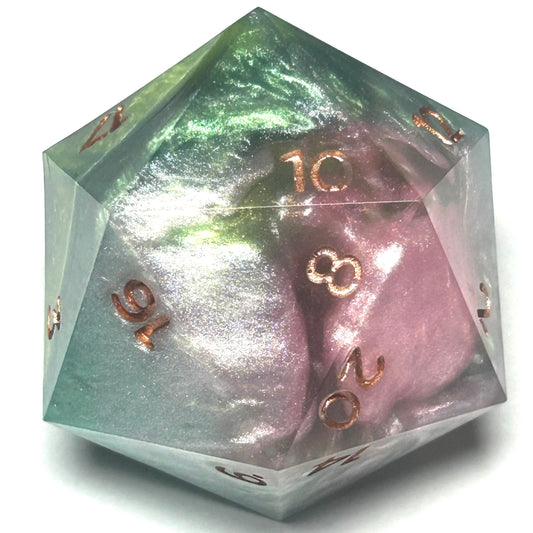 Handmade 40mm chonk D20 featuring pearlescent green and violet resin with metallic copper numbers.