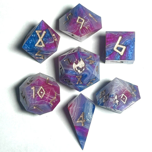 Handmade 7-piece resin dice set with purple, blue, and white swirls and gold numbers, designed for Dungeons & Dragons and tabletop RPGs.