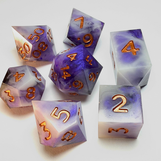 Jumbo handmade resin dice set featuring swirling purple and white tones with metallic copper numbering, shown under soft lighting — Infernal Crafts Amethyst Veil dice set