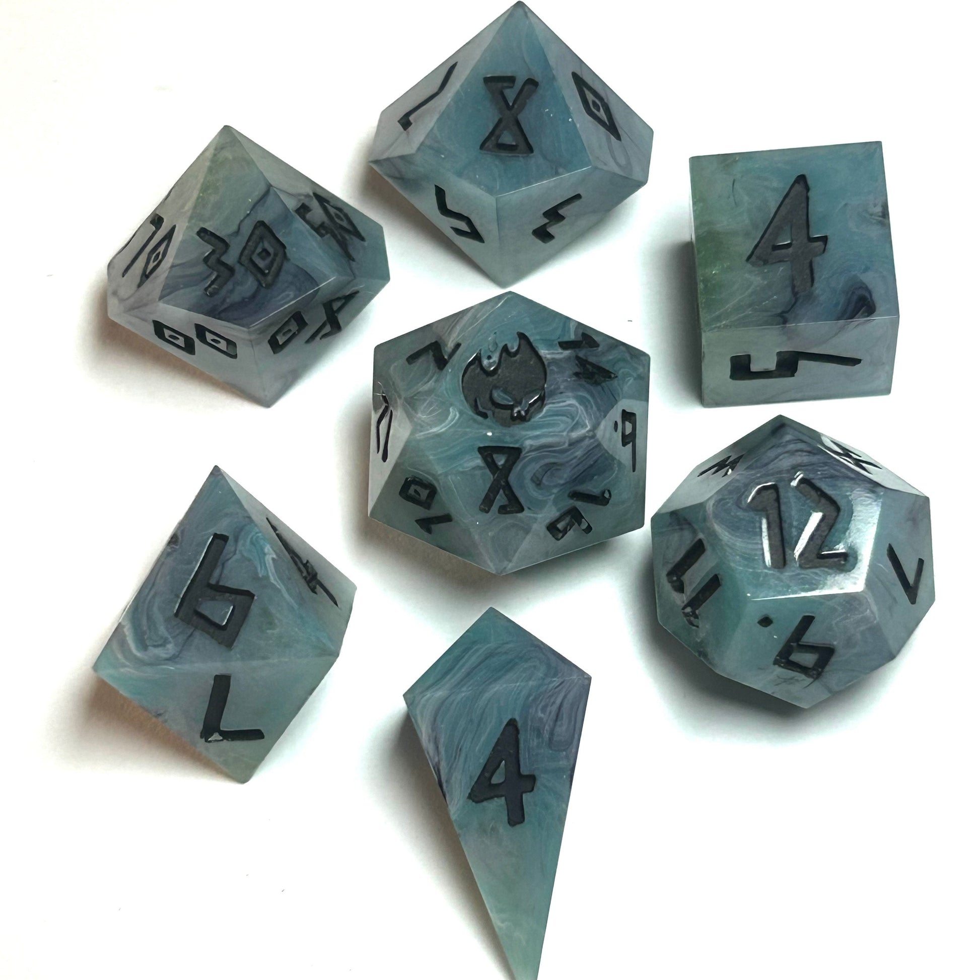 istbourne handmade resin dice set featuring swirling teal and gray resin with bold black numbering — full 7-piece set by Infernal Crafts