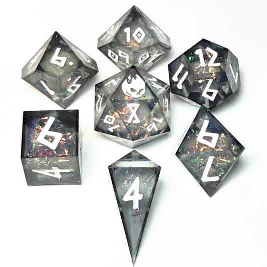Handmade resin dice set with dark smoky translucent resin, white numbering, and shimmering prismatic flakes — Infernal Crafts Shadowflame Prism dice set