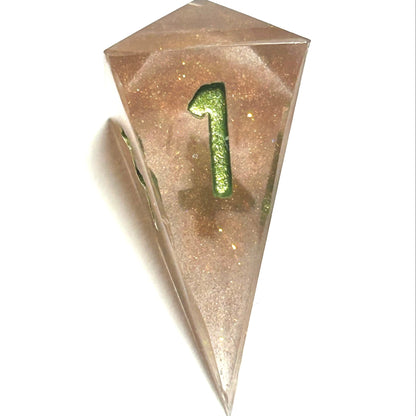 D4 die from the Verdigrace handmade resin dice set, with warm golden resin and a gleaming green number four