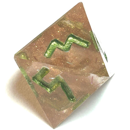 D8 die from the Verdigrace resin dice set featuring translucent golden blush resin and green engraved numerals