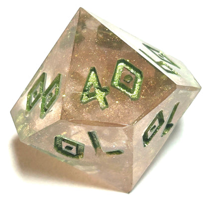 Percentile die from the Verdigrace resin dice set, featuring translucent golden resin with bright green numbering